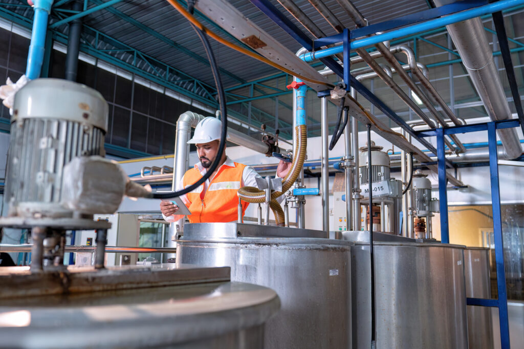 Engineer works on water utilities at a processing plant