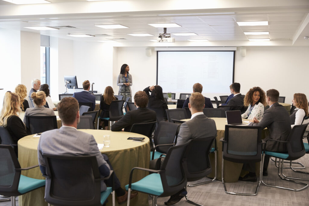 Woman trains staff on cybersecurity awareness