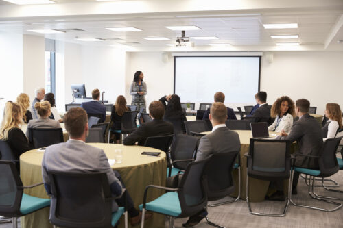 Woman trains staff on cybersecurity awareness